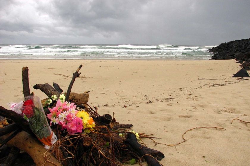 Grief: Flowers on Lighthouse Beach after the attack.