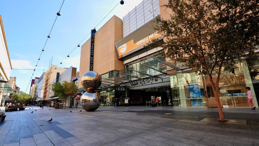 The Adelaide Central Plaza entrance in Rundle Mall with a tree and malls balls outside