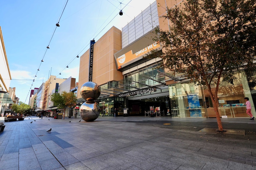 The Adelaide Central Plaza entrance in Rundle Mall with a tree and malls balls outside