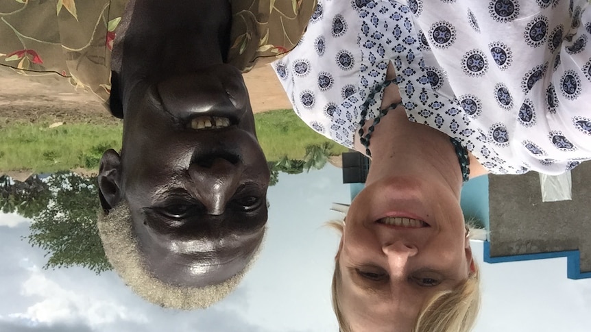 Sally Sara and Hellen Lanyom smile at the camera in Uganda.