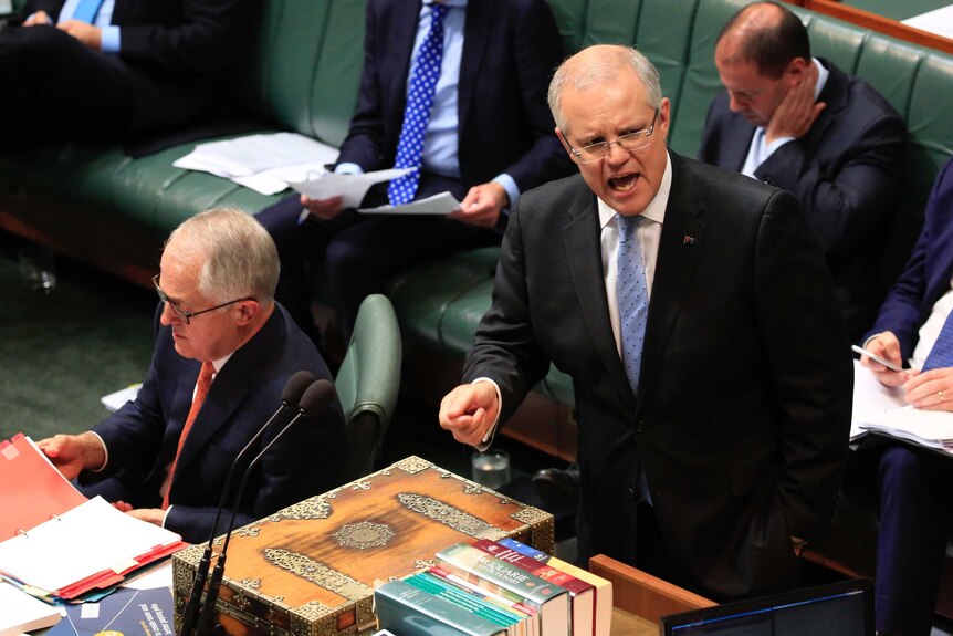 Treasurer Scott Morrison speaks at the dispatch box in House of Representatives, with Prime Minister Malcolm Turnbull