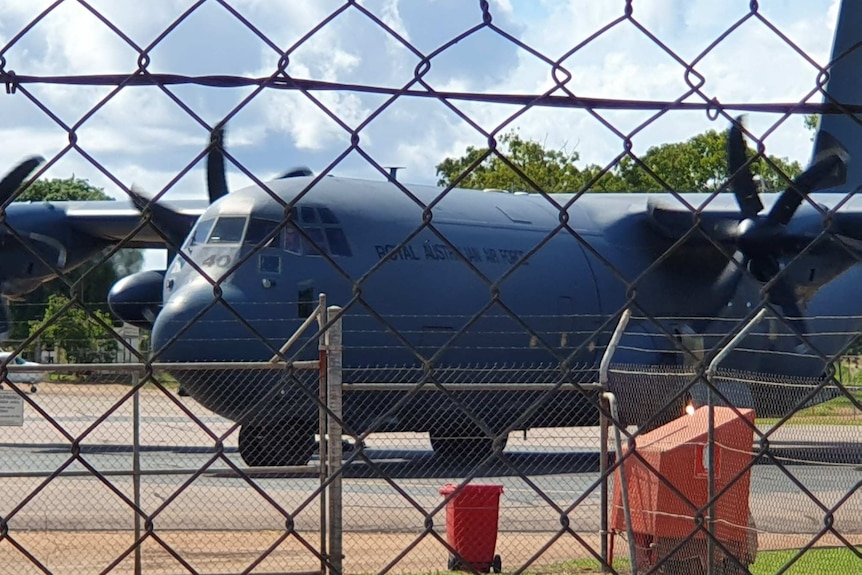 A Royal Australian Air Force plane arrives on Groote Eylandt to evacuate residents.