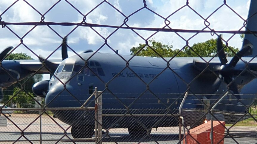 A Royal Australian Air Force plane arrives on Groote Eylandt to evacuate residents.