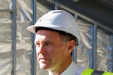 Three men in high vis building gear and hard hats