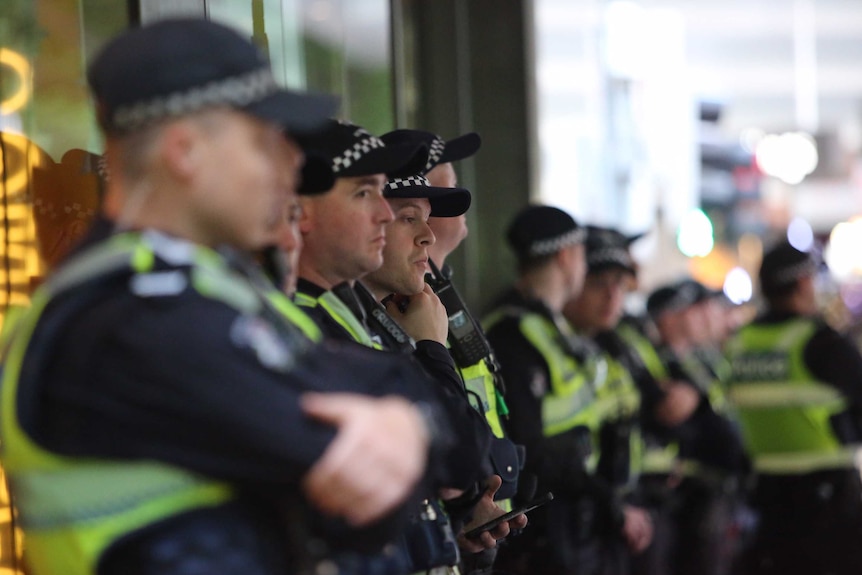 A line of uniformed police in central Melbourne.