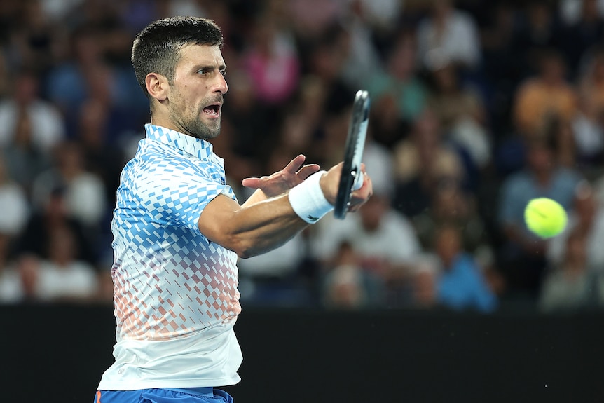 Novak Djokovic hits a forehand during the Australian Open men's final.
