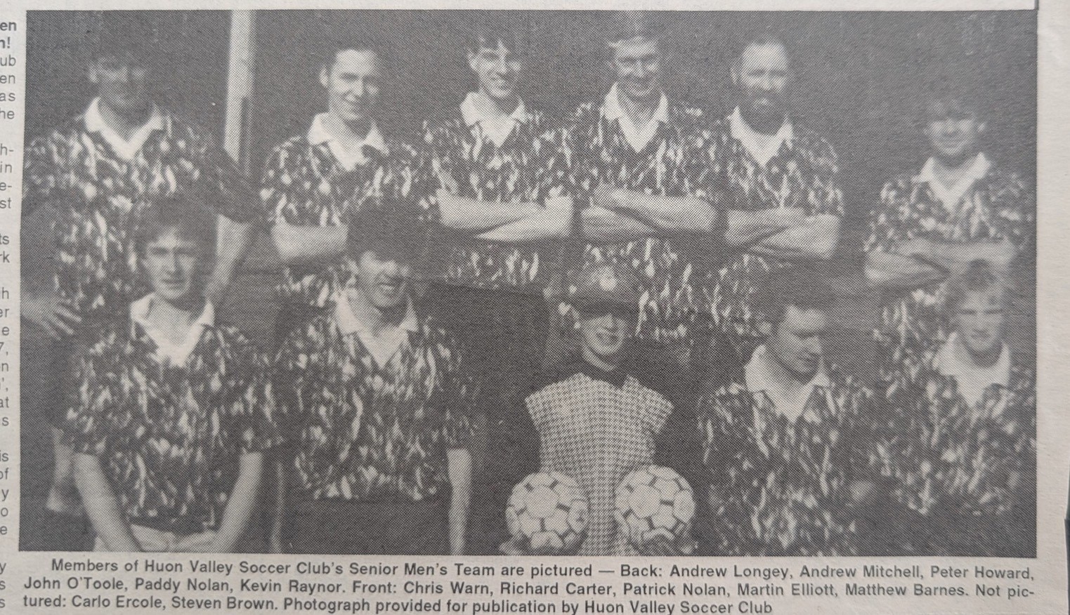 Black and white newspaper clipping photo of men's soccer team