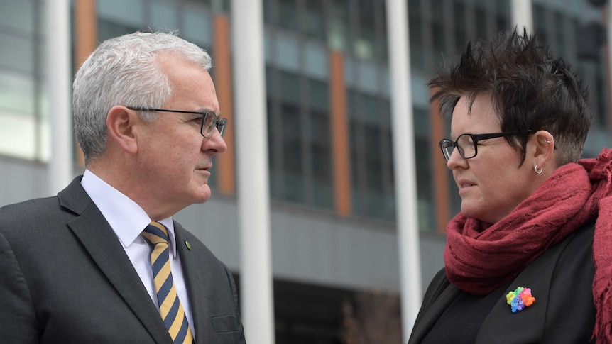 Felicity Marlowe and Federal Independent MP Andrew Wilkie (left) stand face to face outside court in Melbourne.