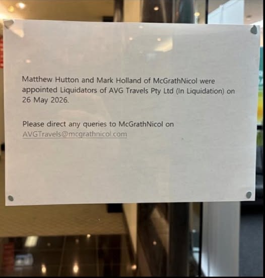 A piece of paper stuck on a glass door saying McGrathNicol were appointed liquidators of AVG Travels on May 26.