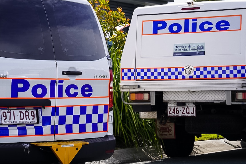 Police cars at a suburban house
