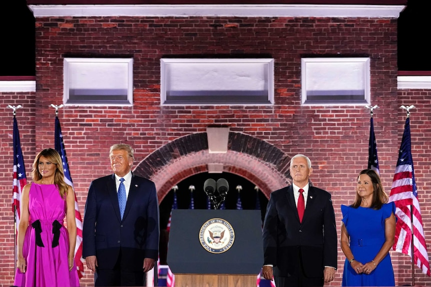 Donald and Melania Trump stand next to Mike and Karen Pence