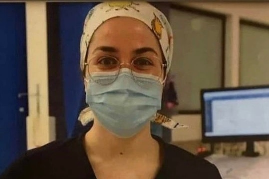 Young female doctor in scrubs 