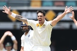 Mitchell Johnson celebrates the wicket of Rohit Sharma