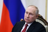 Russian President Vladimir Putin chairs a meeting with members of the government