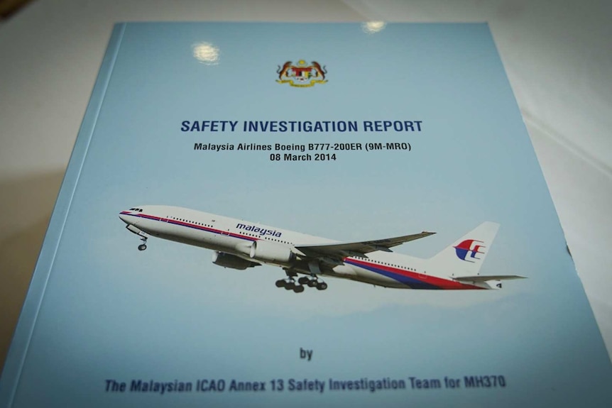 A close image of the MH370 Safety Investigation Report cover.
