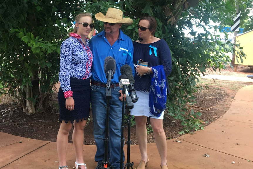 From left to right Meg Everett, Tick Everett and Kate Everett speak to the media.