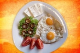 Juicy breakfast with eggs mushrooms tomatoes lettuce and cheese