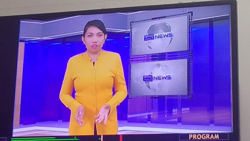 A woman presenting news