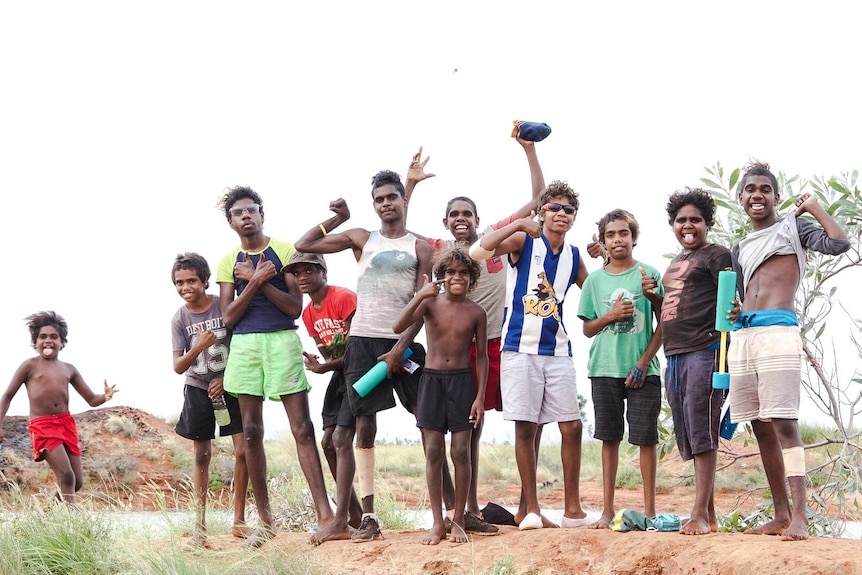 Group of Aboriginal boys posing for the camera.