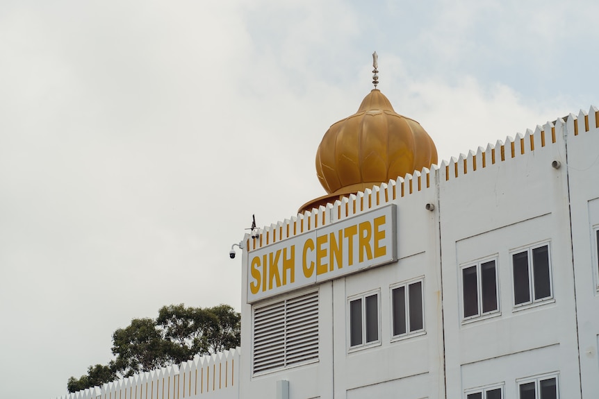 A Sikh temple with a sign reading 'Sikh Centre'.
