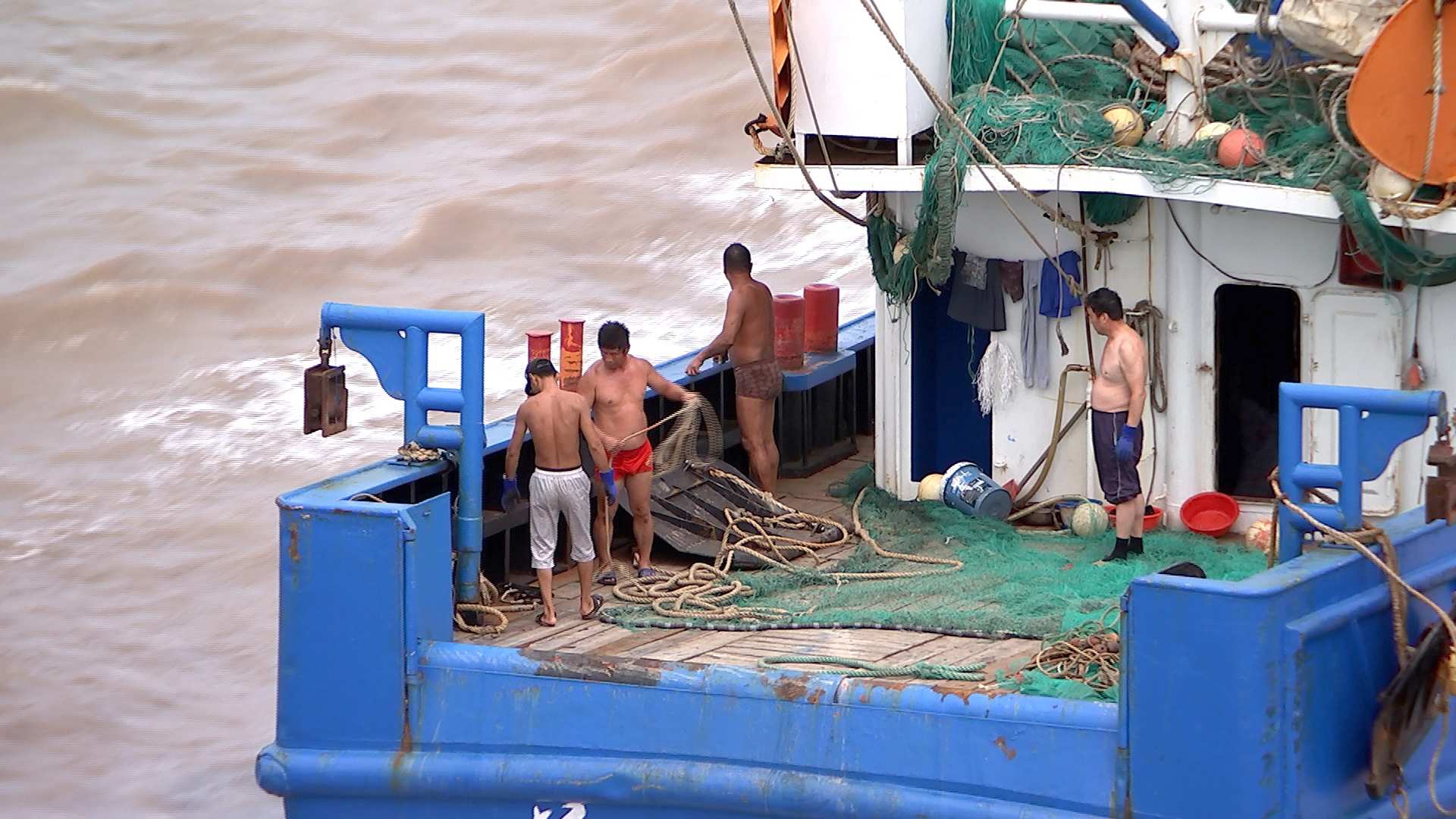 Four fishermen on a Zhoushan fishing boat