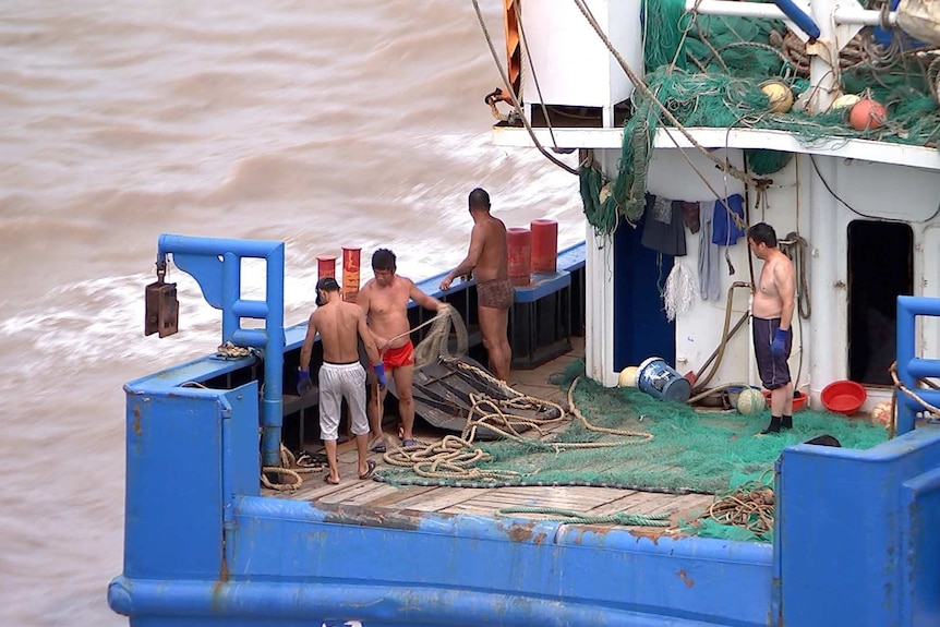 Four fishermen on a Zhoushan fishing boat
