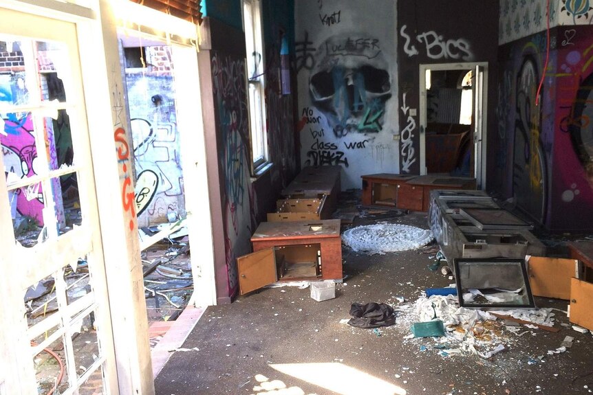 A photograph taken inside the Broadway Hotel before it burnt down in September 2018 showing broken glass