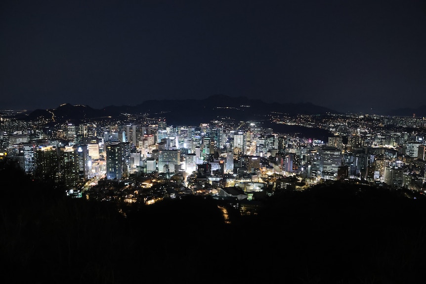 Landscape of the city of Seoul from above at night. Lights of buildings and surrounds are on
