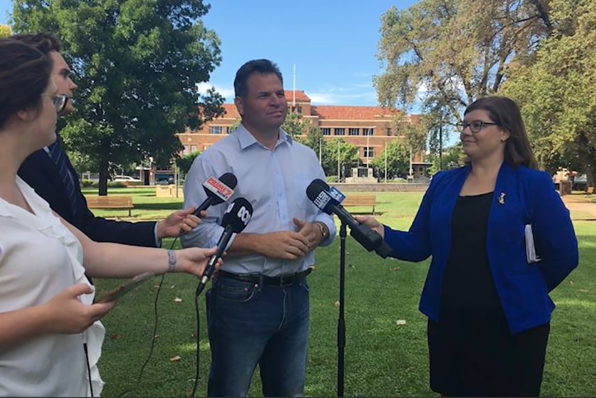 Shooters, Farmers, Fishers Party MP Phil Donato at a media conference in Orange, with three journalists