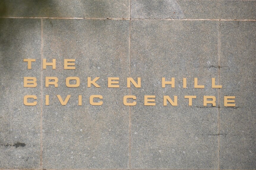 Gold lettering that says "Broken Hill Civic Centre", on a stone wall.