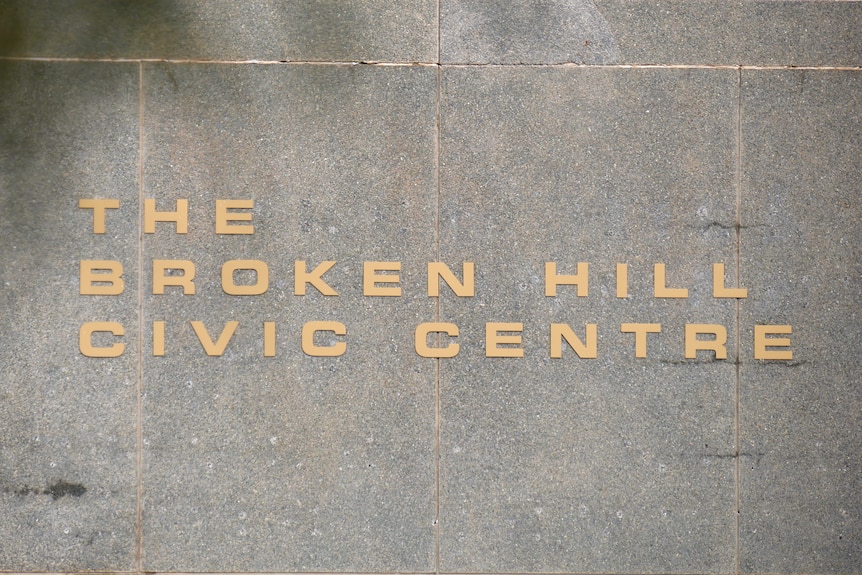 Gold lettering that says "Broken Hill Civic Centre", on a stone wall.