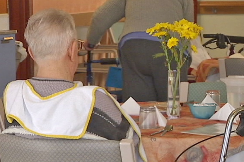 Video still: Unidentified man sitting at a table in a Canberra nursing home - generic