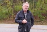 Alec Baldwin speaking to photographers from the side of the road in Vermont.