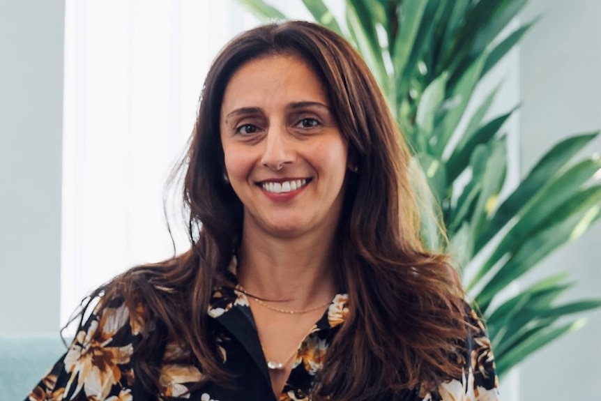 A woman smiling to camera