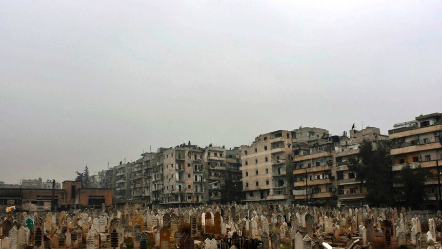 This photo released by the Syrian official news agency SANA, shows a graveyard in east Aleppo, Syria, Tuesday, Dec. 13, 2016