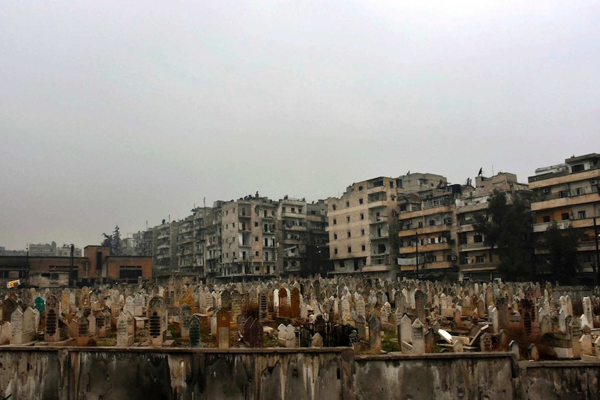 This photo released by the Syrian official news agency SANA, shows a graveyard in east Aleppo, Syria, Tuesday, Dec. 13, 2016