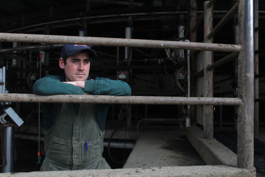 Will Ryan looks out from an empty dairy.