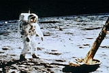 Buzz Aldrin walks on the moon.