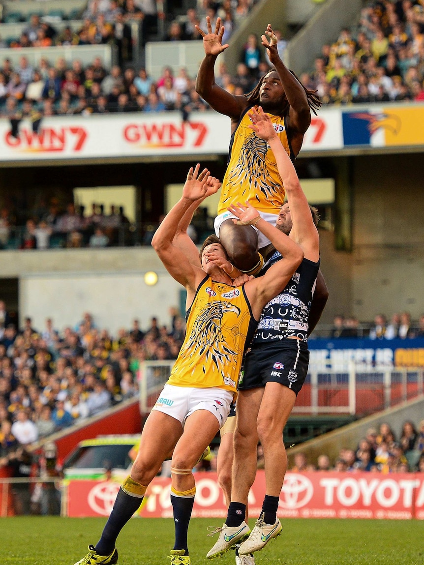 West Coast's Nic Naitanui flies for a mark against Geelong at Subiaco Oval.