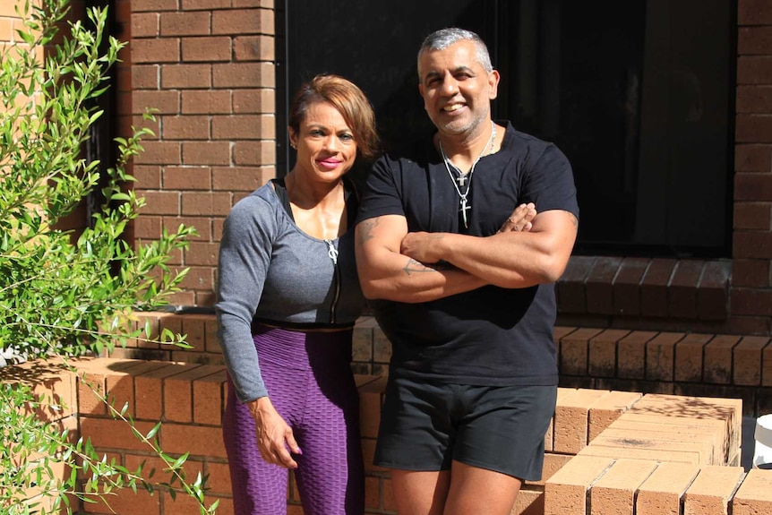 Janita Singh and Ajenda Diwakar stand outside their home.