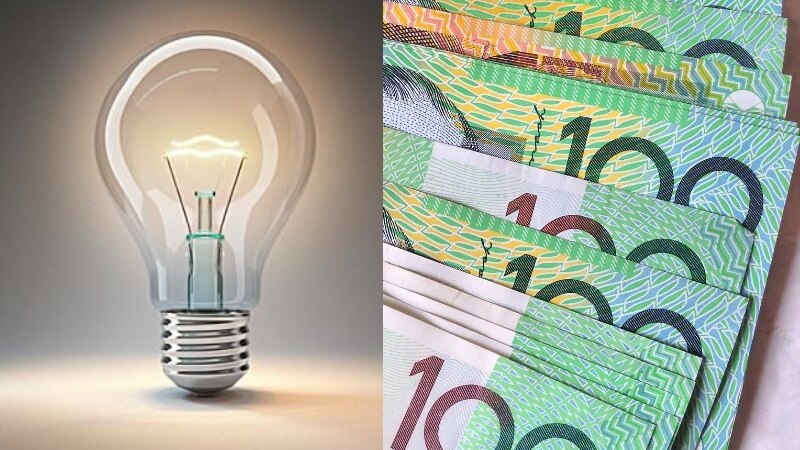 a light bulb and multiple green bank notes 