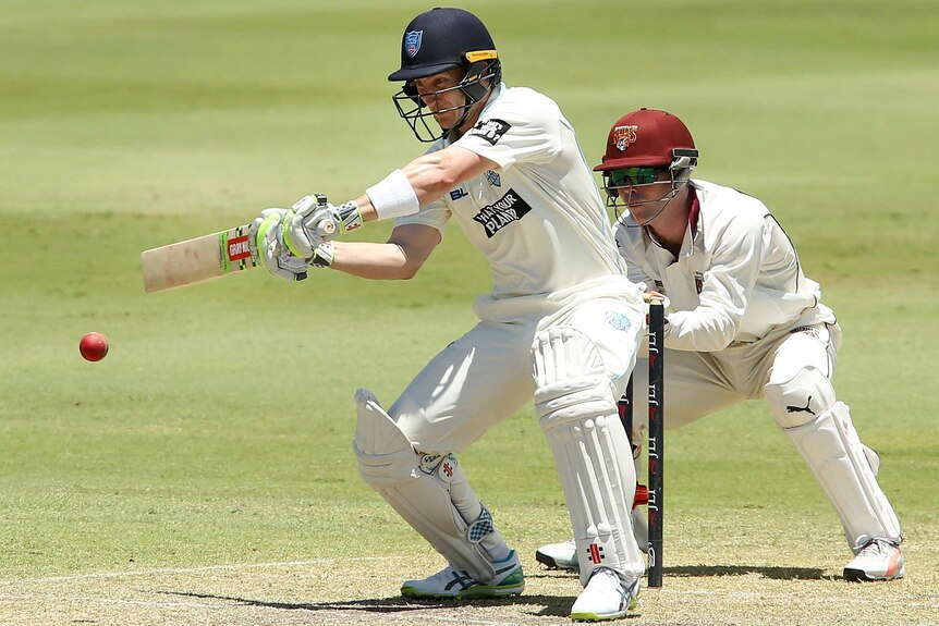 Peter Nevill attempts to play a shot to the off side against Queensland in the Sheffield Shield match at Allan Border Field.