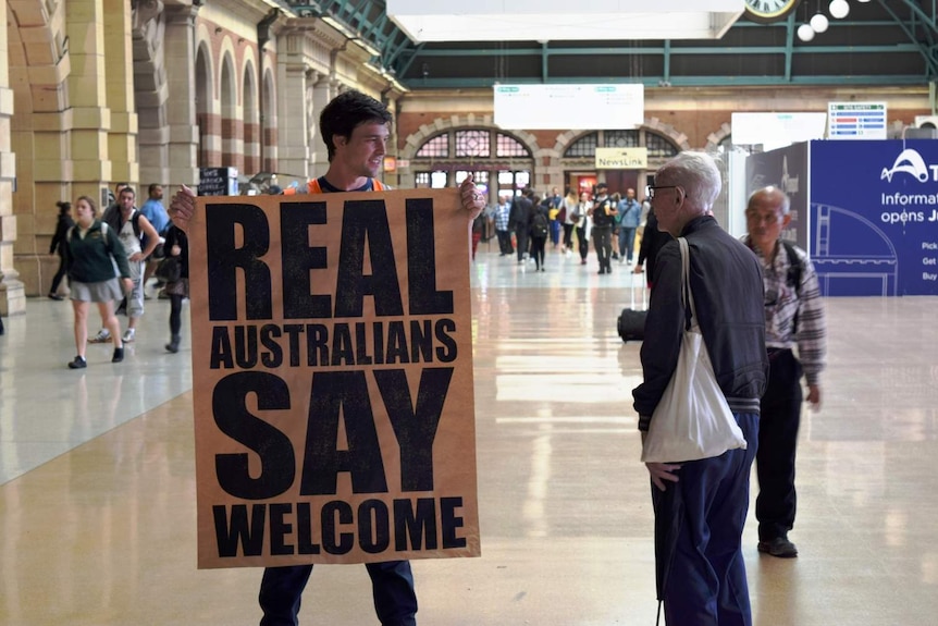 Peter Drew talks to a passer-by about the project