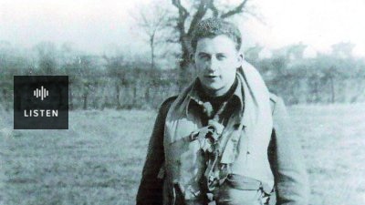 A young man wearing an old fashioned flying suit. Has Audio.