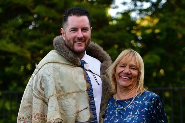 Marcus Stewart, draped in a possum-skin cloak and Geraldine Atkinson stand together.
