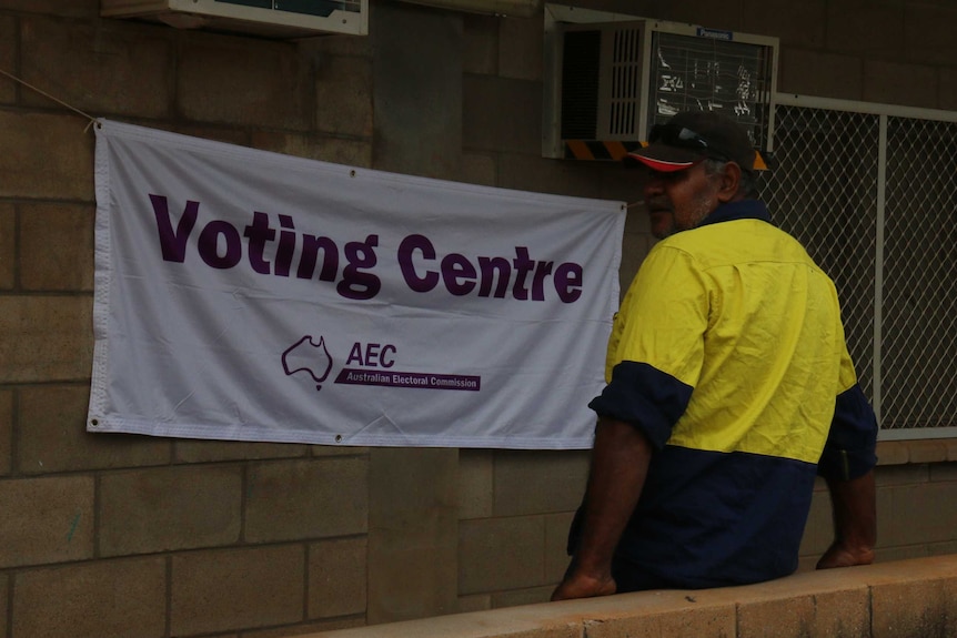 A man outside a makeshift voting centre.