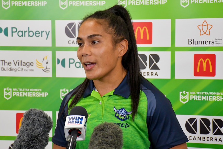 A woman being interviewed in uniform at a club Canberra Raiders press conference 