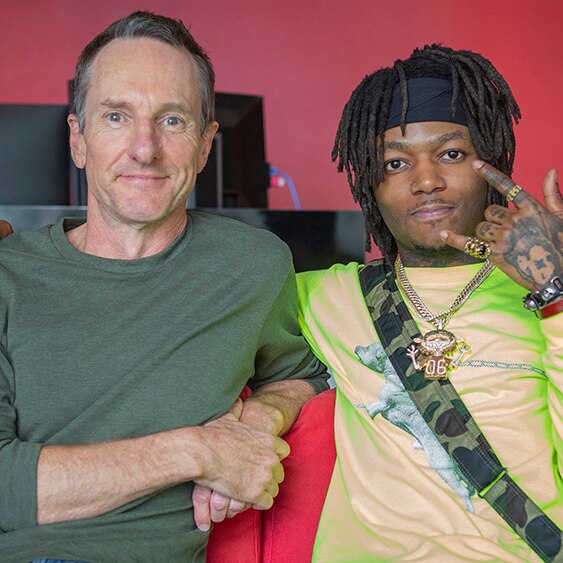 Photograph of JID and Richard Kingsmill on a couch at the triple j office