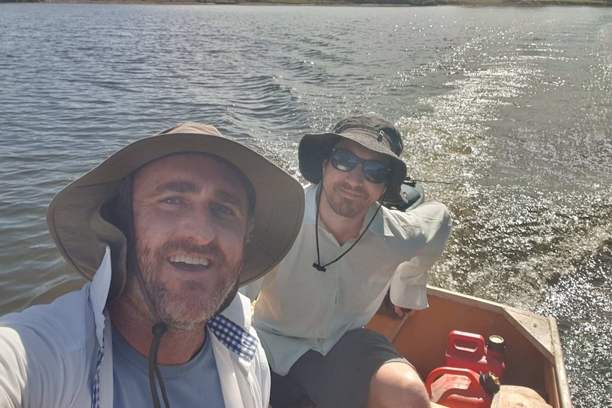 Two men in a boat.