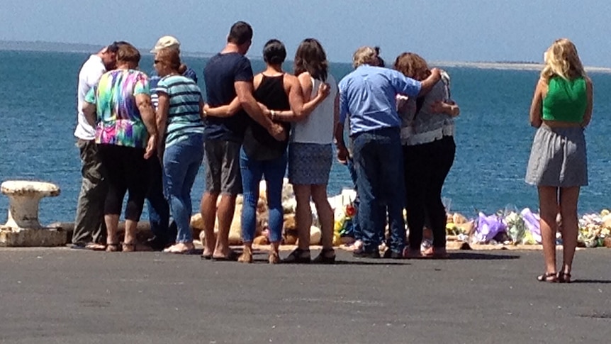 Family look at tribute for Little family at Port Lincoln